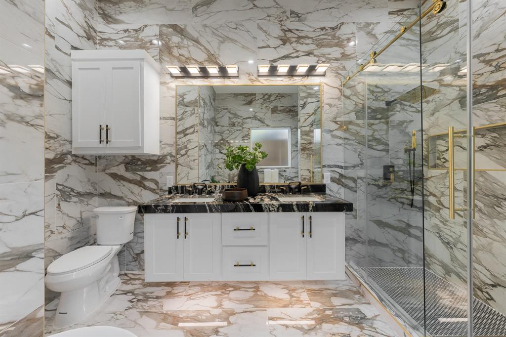 3351 Sylvan Avenue Dallas, TX 75212 - Photo 25 of 40 a bathroom with a sink a toilet and shower