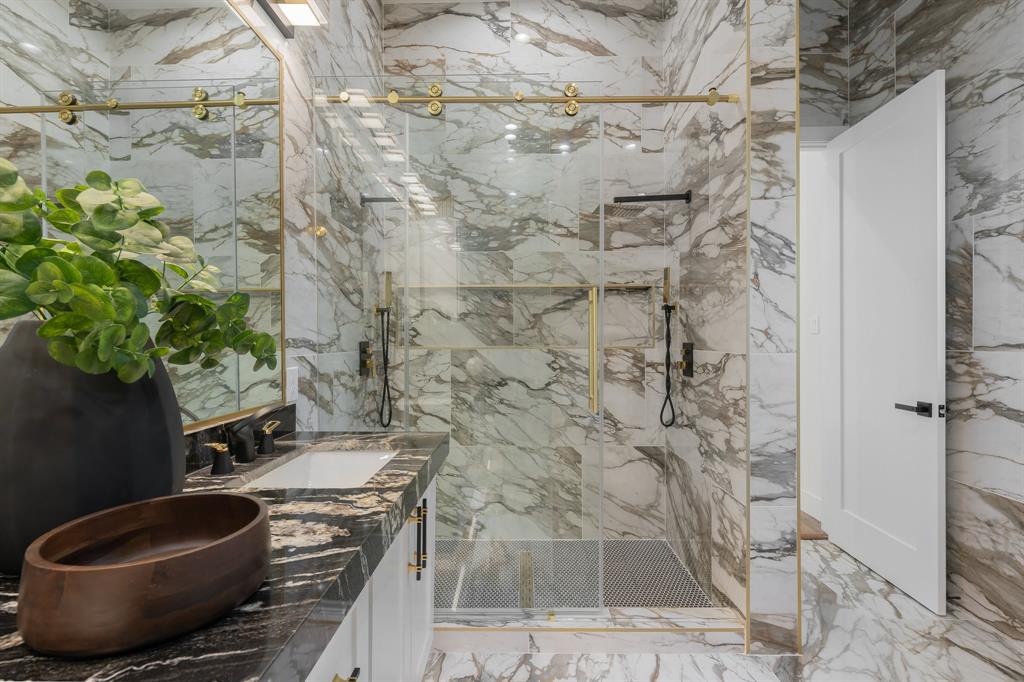 3351 Sylvan Avenue Dallas, TX 75212 - Photo 26 of 40 a bathroom with a granite countertop shower and a sink