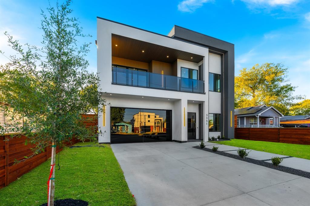 3351 Sylvan Avenue Dallas, TX 75212 - Photo 3 of 40 a front view of a house with a yard and potted plants