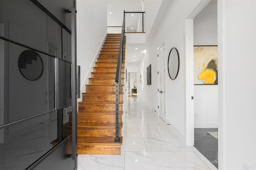 3351 Sylvan Avenue Dallas, TX 75212 - Photo 7 of 40 a view of a hallway with wooden floor and staircase