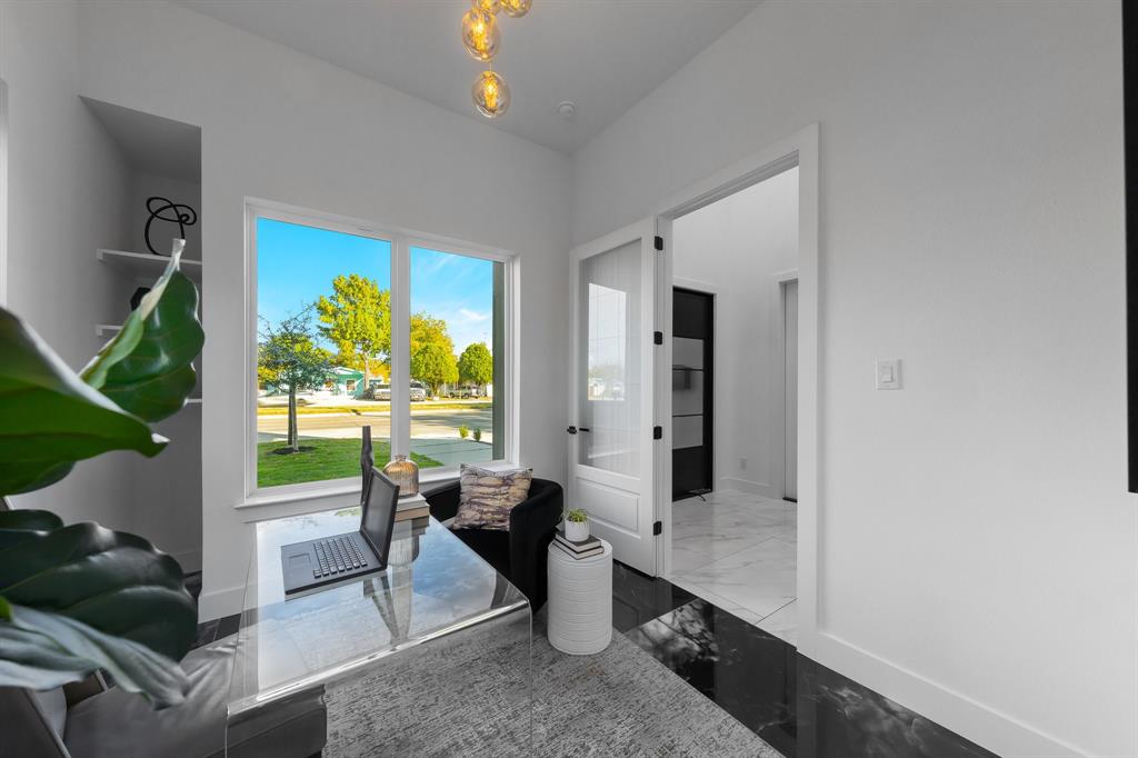 3351 Sylvan Avenue Dallas, TX 75212 - Photo 10 of 40 an open dining room with furniture and a floor to ceiling window