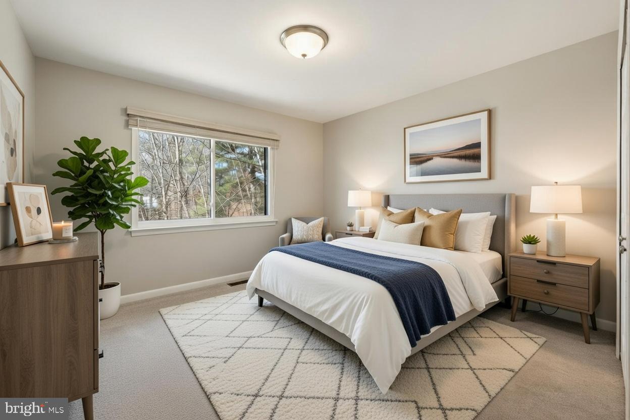 1942 Winterport Cl Reston, VA 20191 - Photo 17 of 19 a bedroom with a bed and a window