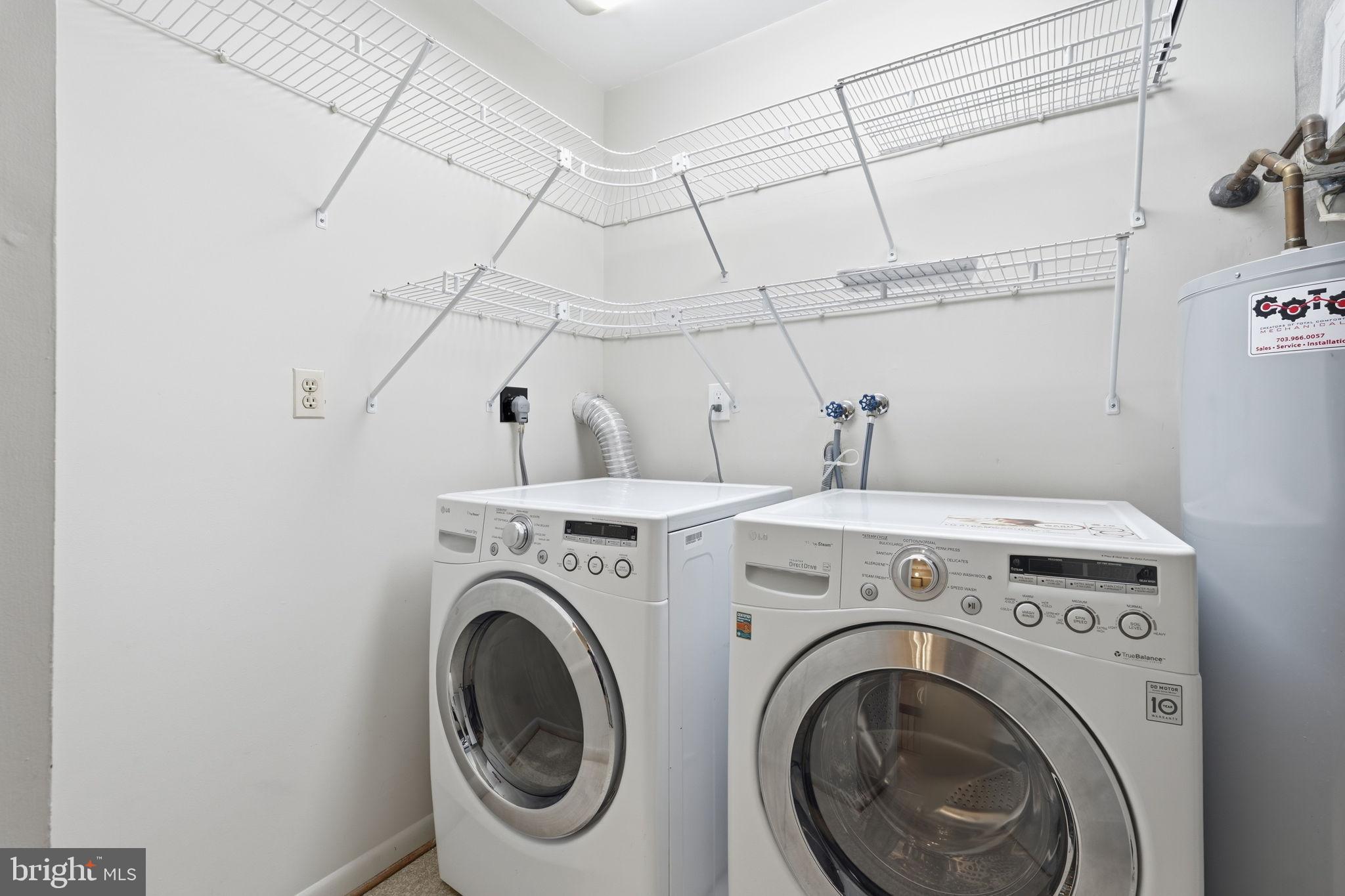 1942 Winterport Cl Reston, VA 20191 - Photo 18 of 19 a utility room with dryer and washer