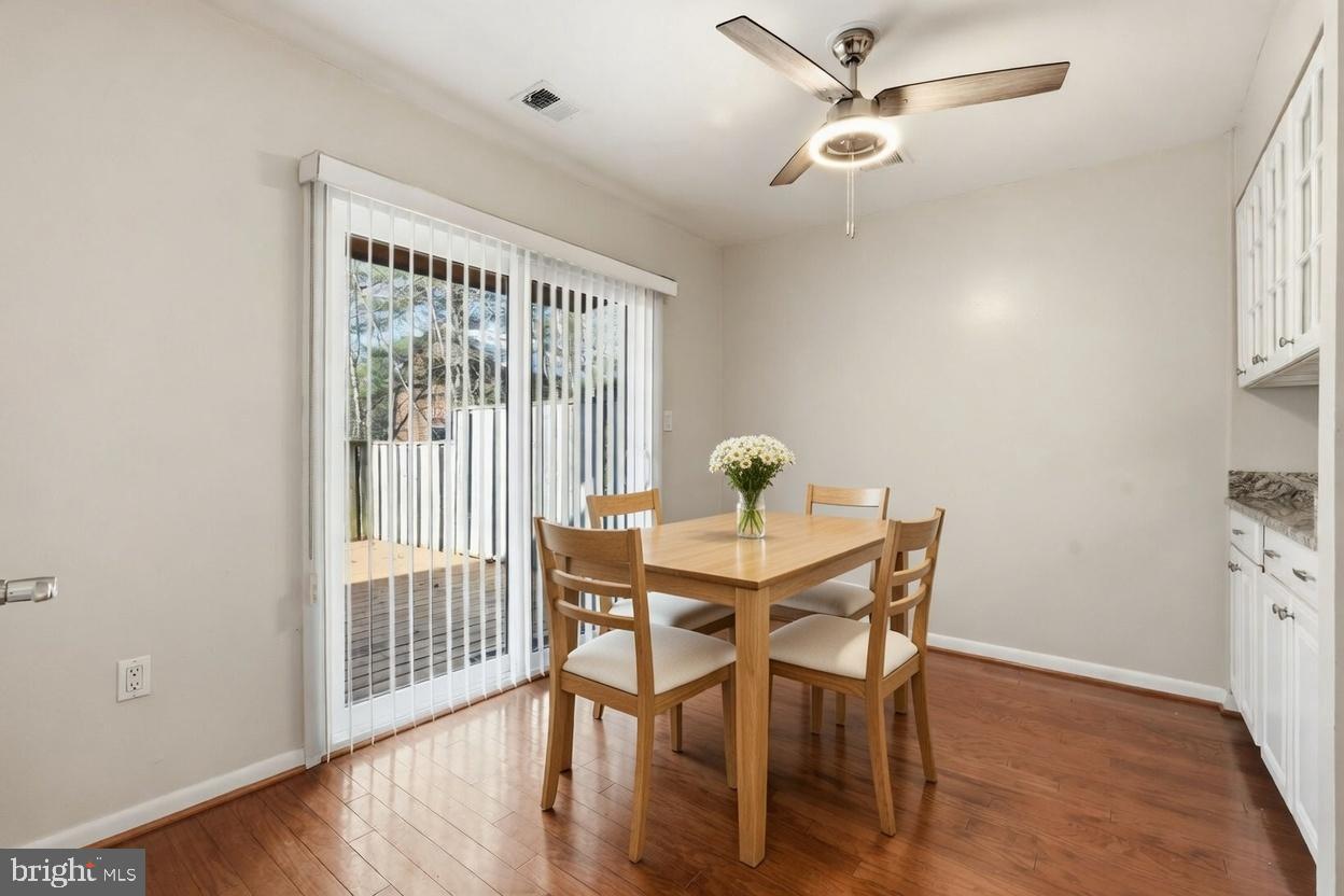 1942 Winterport Cl Reston, VA 20191 - Photo 3 of 19 a view of a dining room with furniture window and wooden floor
