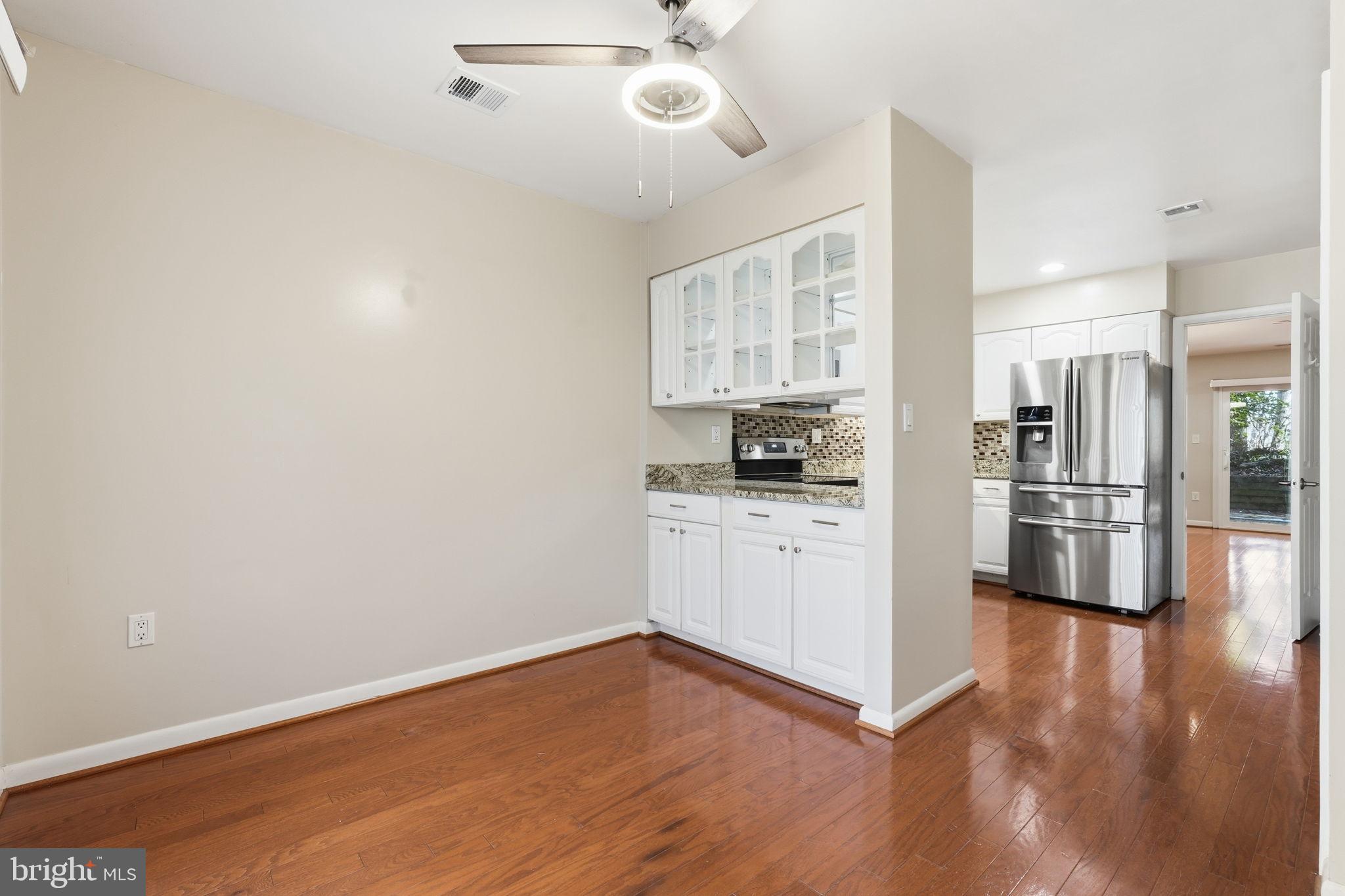 1942 Winterport Cl Reston, VA 20191 - Photo 4 of 19 a kitchen with stainless steel appliances a refrigerator and a stove top oven