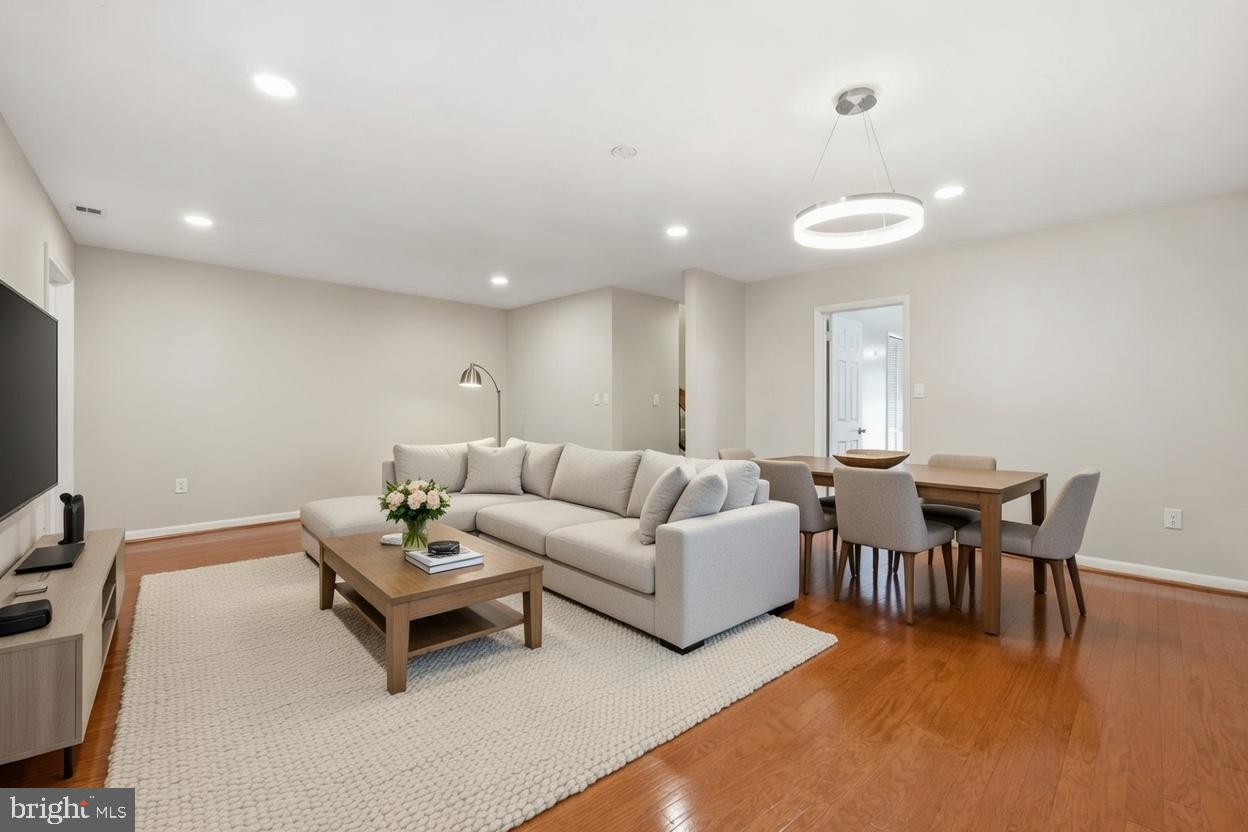 1942 Winterport Cl Reston, VA 20191 - Photo 7 of 19 a living room with furniture and a flat screen tv
