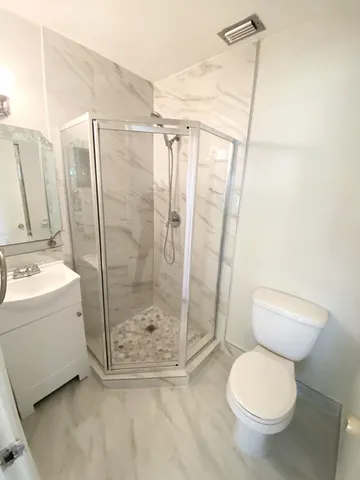 a view of a swimming pool with outdoor seating and plants