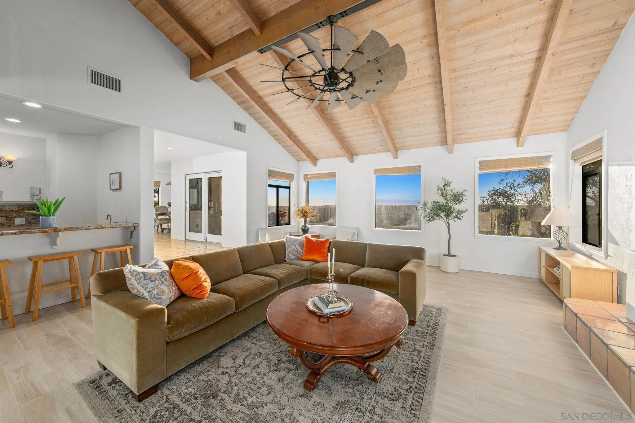 2323 Wilt Road Fallbrook, CA 92028 - Photo 14 of 28 a living room with furniture a chandelier and a rug