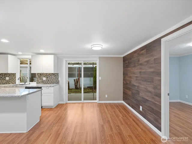 a view of kitchen with cabinets and wooden floor