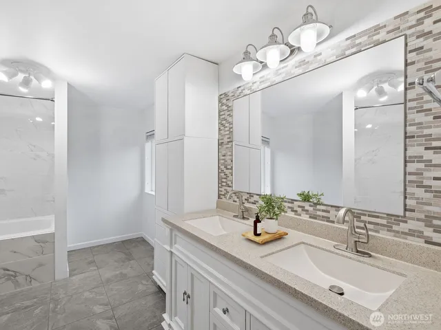 a bathroom with a sink double vanity and a mirror