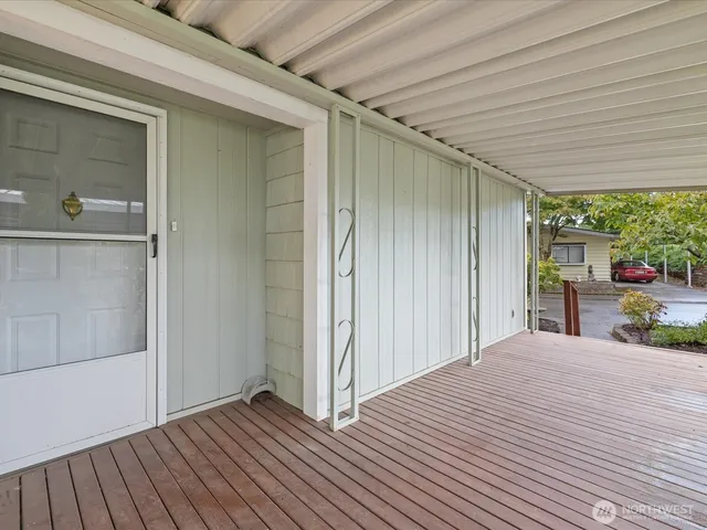 a very nice looking room with wooden floor and a window