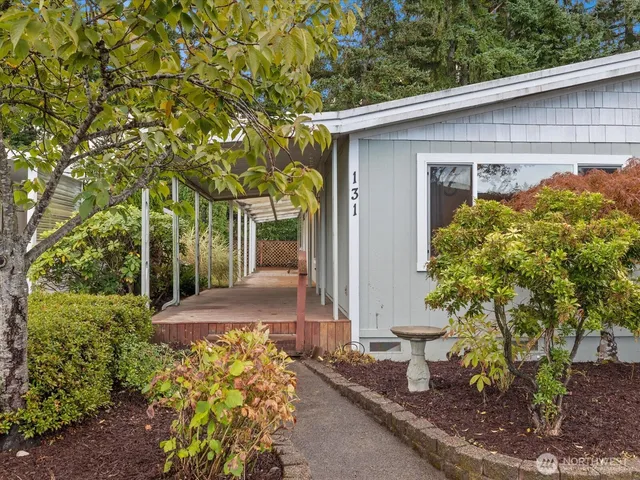 a couple of potted plants in front of door