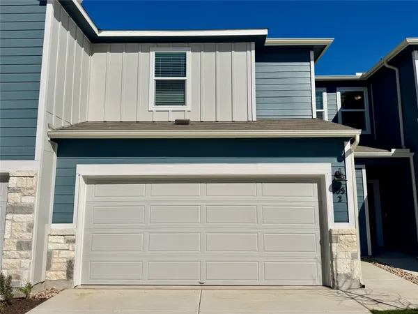 a view of house with garage