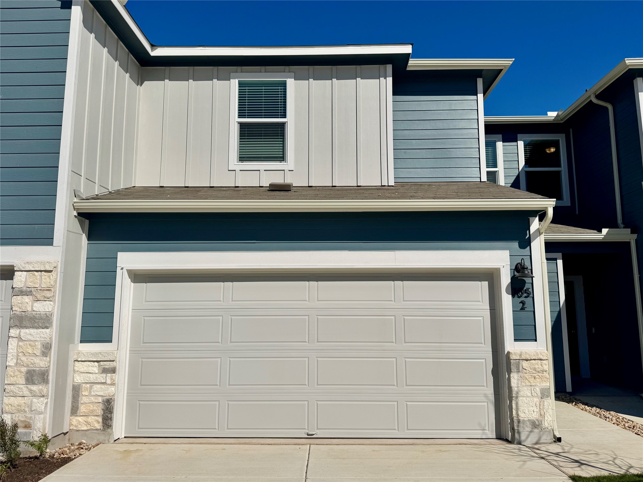 Garage with concrete driveway