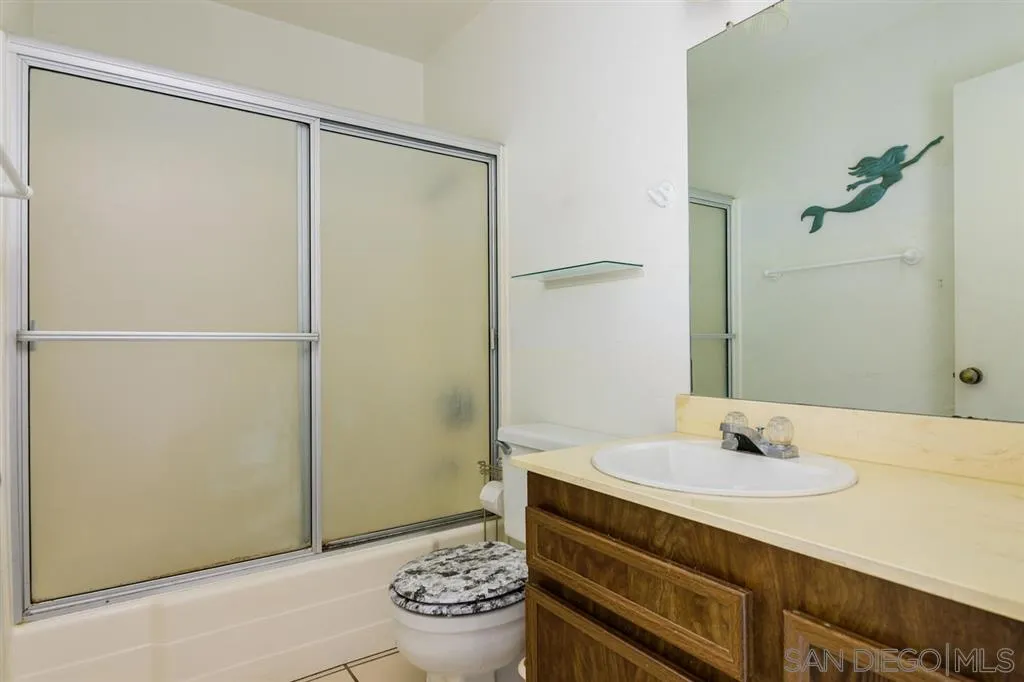 9204 Mast Boulevard, Unit 40 Santee, CA 92071 - Photo 15 of 21 a bathroom with a sink and a mirror