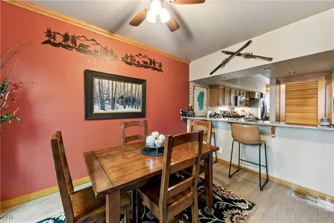 a view of a dining room with furniture and window