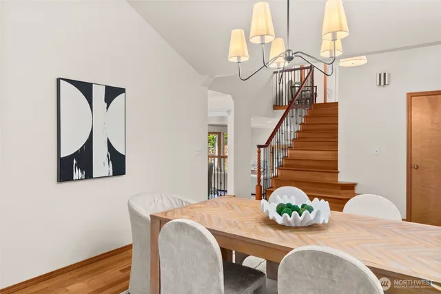 a living room with furniture a fireplace and a large window