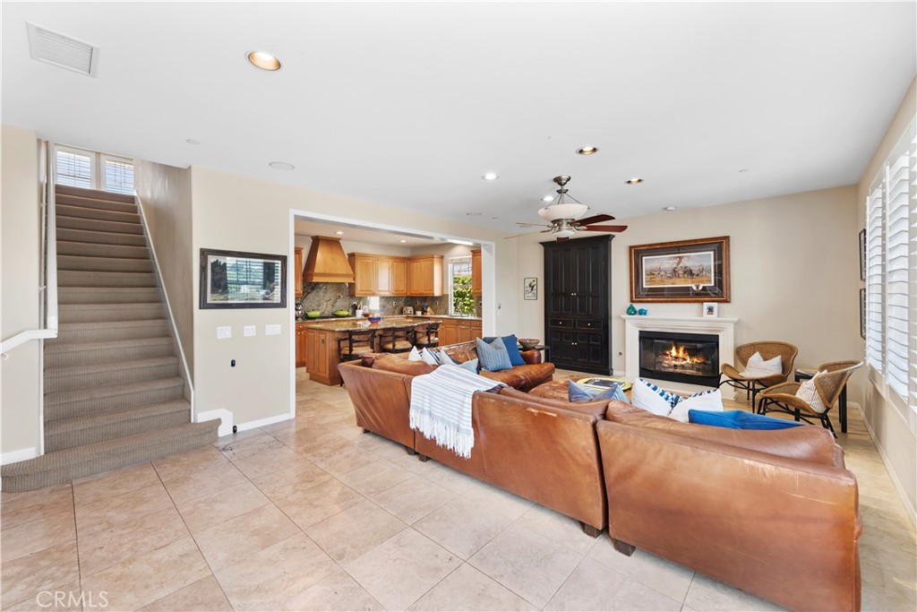 15 Corte Limonada San Clemente, CA 92673 - Photo 25 of 64 a living room with fireplace furniture and a flat screen tv