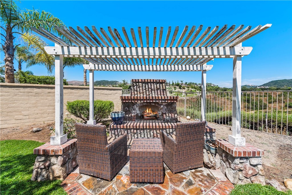 15 Corte Limonada San Clemente, CA 92673 - Photo 33 of 64 a view of a patio with a table chairs and a patio