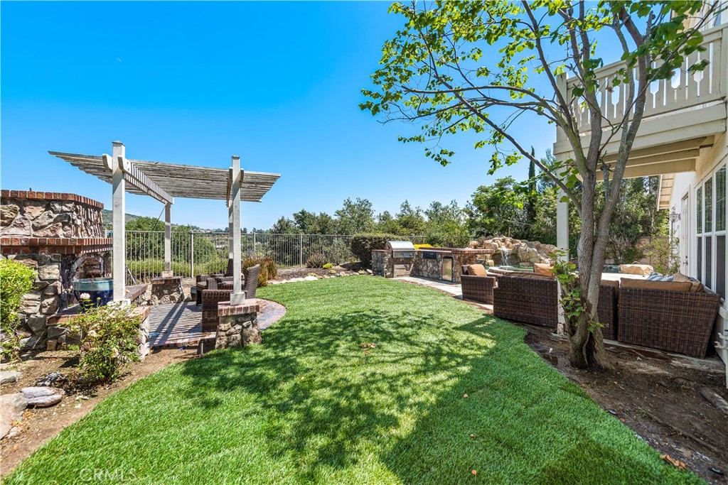 15 Corte Limonada San Clemente, CA 92673 - Photo 35 of 64 a view of a chair and tables in the backyard