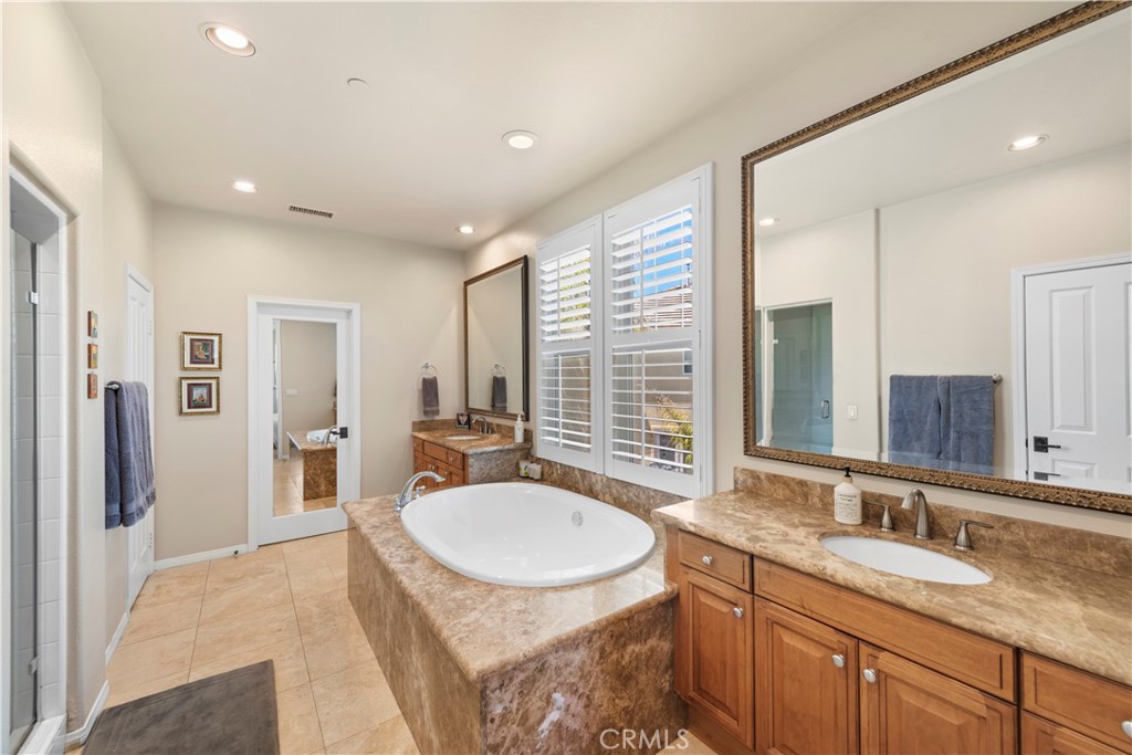 15 Corte Limonada San Clemente, CA 92673 - Photo 39 of 64 a bathroom with a granite countertop sink and a mirror