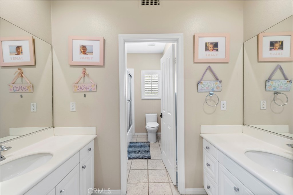 15 Corte Limonada San Clemente, CA 92673 - Photo 43 of 64 a spacious bathroom with a sink and a mirror