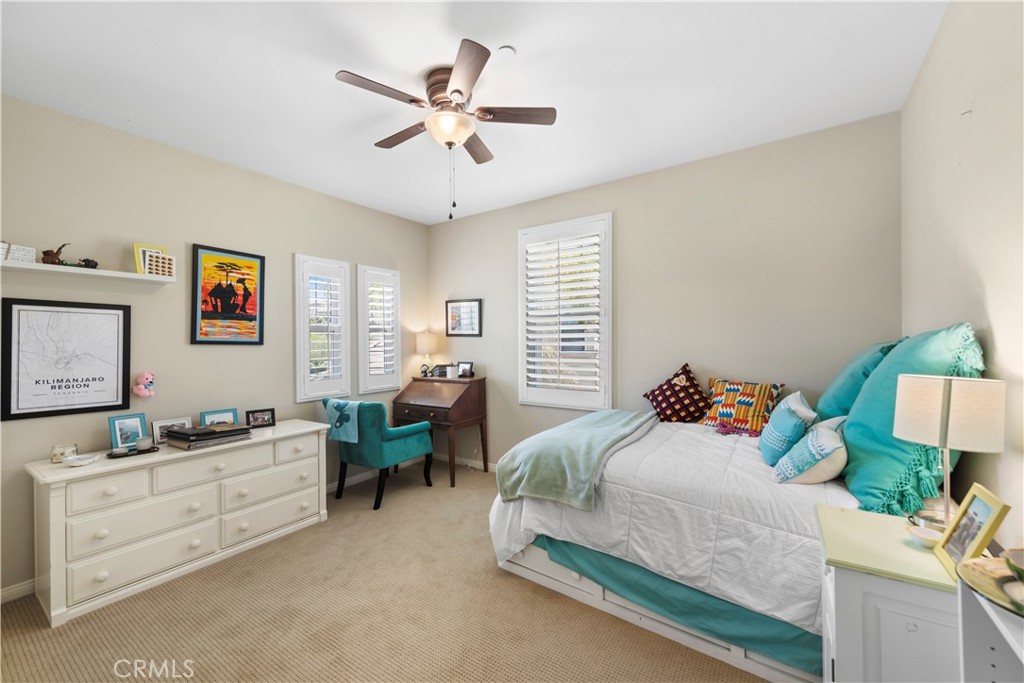 15 Corte Limonada San Clemente, CA 92673 - Photo 46 of 64 a bedroom with a bed and a chandelier