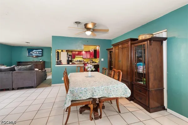 a kitchen with a sink a stove and cabinets