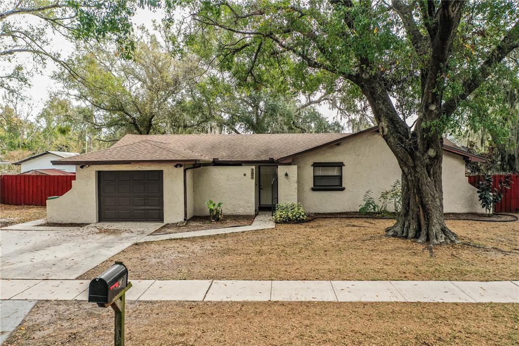 207 24th Court Southwest Winter Haven, FL 33880 - Photo 3 of 75 a front view of a house with yard