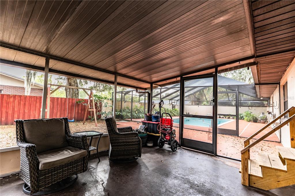 207 24th Court Southwest Winter Haven, FL 33880 - Photo 43 of 75 a living room with furniture a large window with outer view