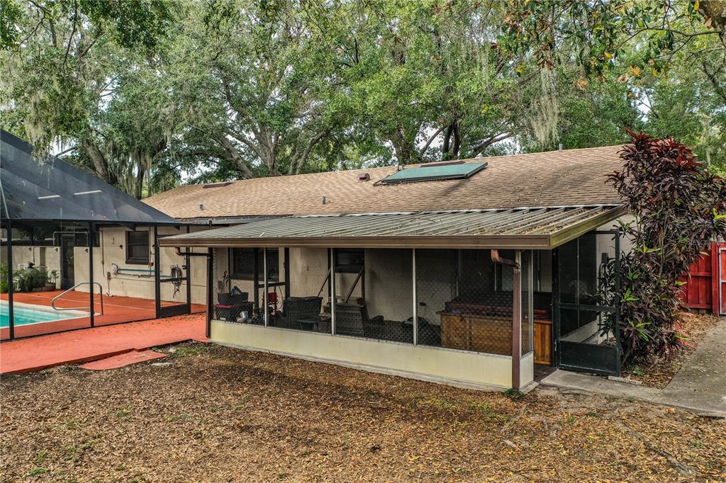 207 24th Court Southwest Winter Haven, FL 33880 - Photo 55 of 75 a view of a house with floor to ceiling windows and a basket ball poll