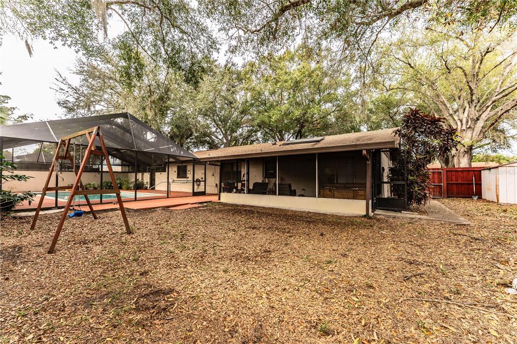 207 24th Court Southwest Winter Haven, FL 33880 - Photo 58 of 75 a house with trees in the background