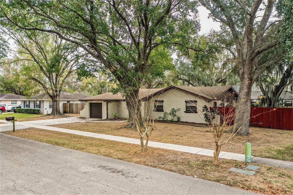 207 24th Court Southwest Winter Haven, FL 33880 - Photo 72 of 75 a view of a house with a yard covered in snow