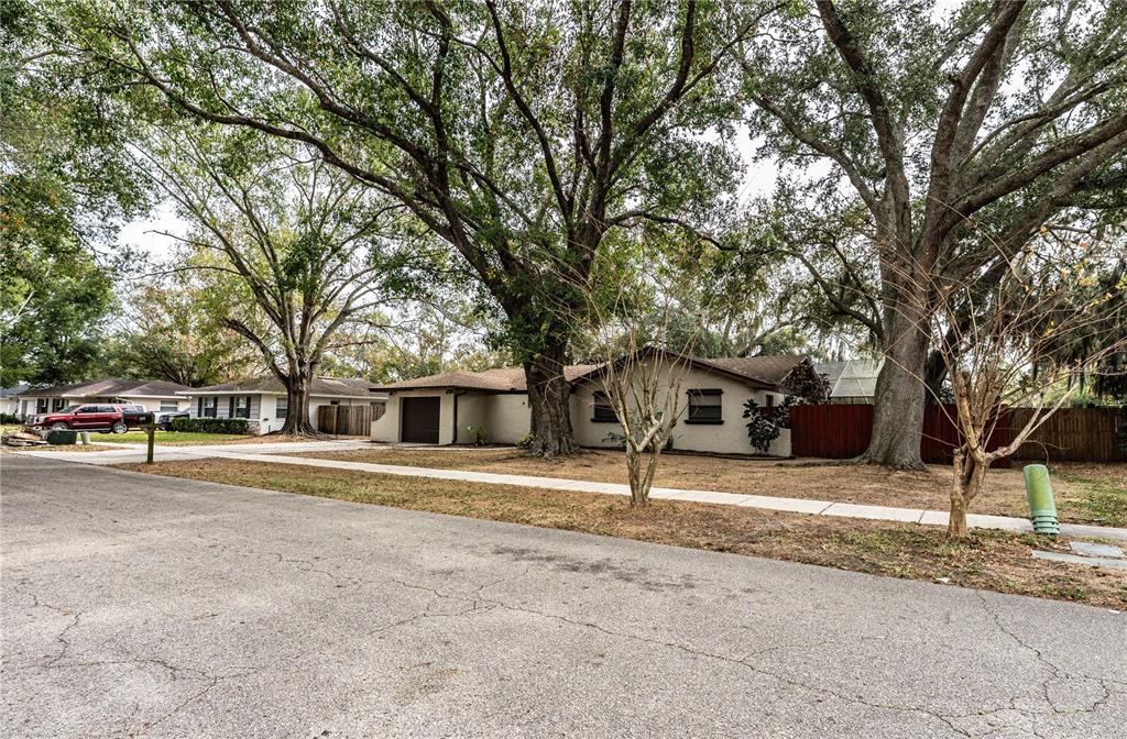 207 24th Court Southwest Winter Haven, FL 33880 - Photo 74 of 75 a house with trees in front of it