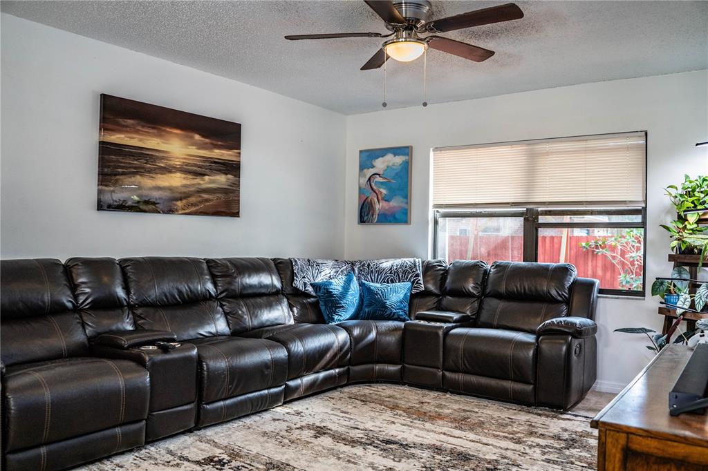 207 24th Court Southwest Winter Haven, FL 33880 - Photo 10 of 75 a living room with furniture and a window