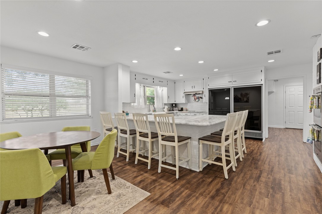 2275 West Moonlight Drive Robinson, TX 76706 - Photo 11 of 40 a dining room with furniture and wooden floor