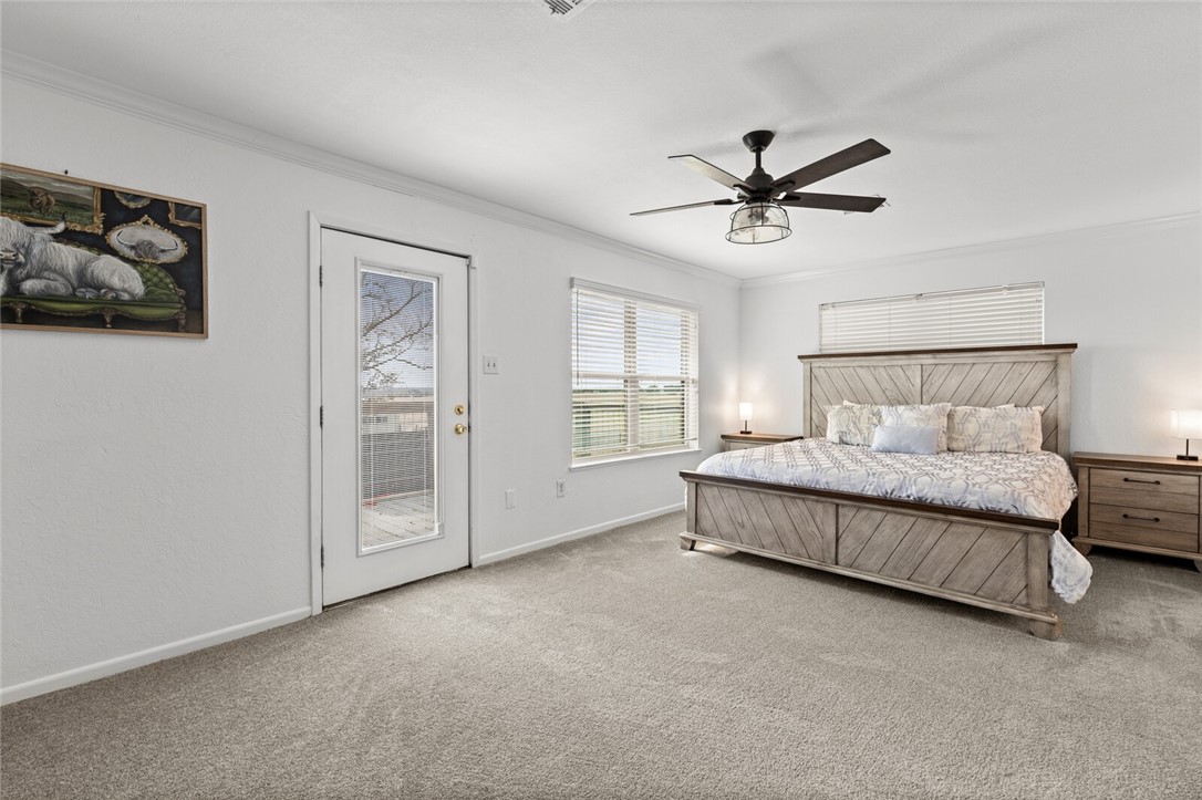 2275 West Moonlight Drive Robinson, TX 76706 - Photo 18 of 40 a spacious bedroom with a bed and painting on the wall