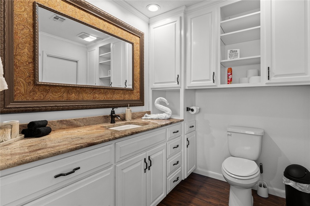 2275 West Moonlight Drive Robinson, TX 76706 - Photo 20 of 40 a bathroom with a toilet sink and mirror