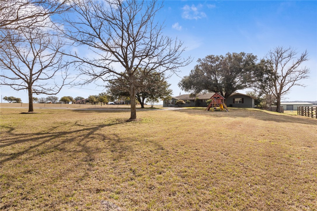 2275 West Moonlight Drive Robinson, TX 76706 - Photo 2 of 40 a view of a yard with a tree