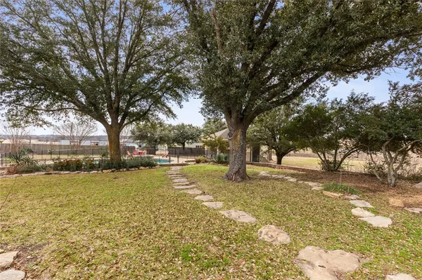 a view of swimming pool with trees