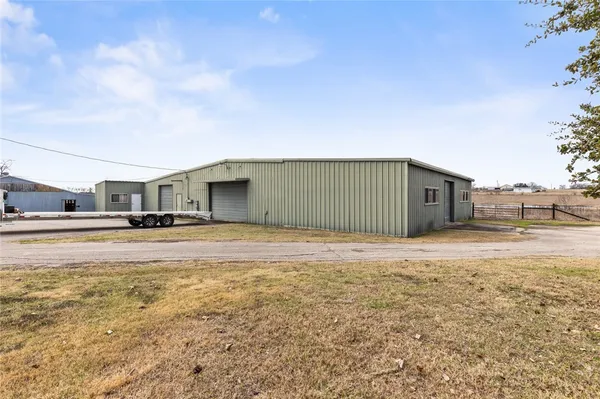 a house view with swimming pool in front of it
