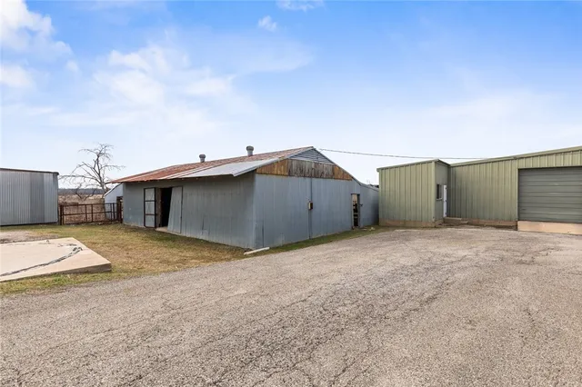 a view of a house with basketball court