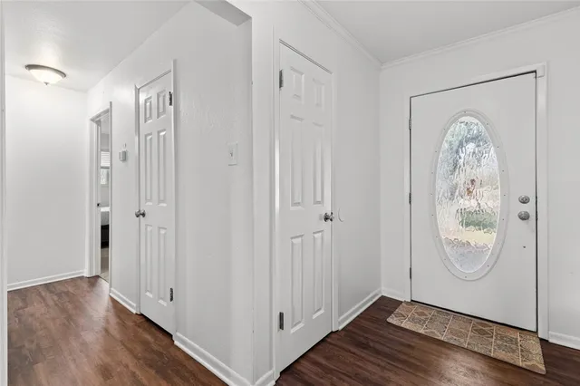 a view of front door with wooden floor