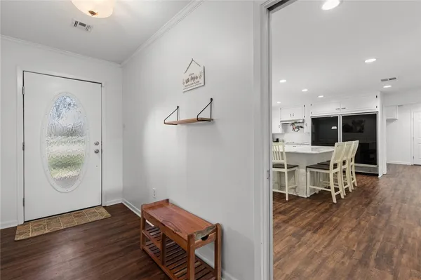 a view of a livingroom with furniture and wooden floor