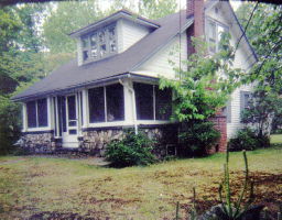 a house view with a garden space