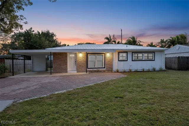 front view of a house with a garden