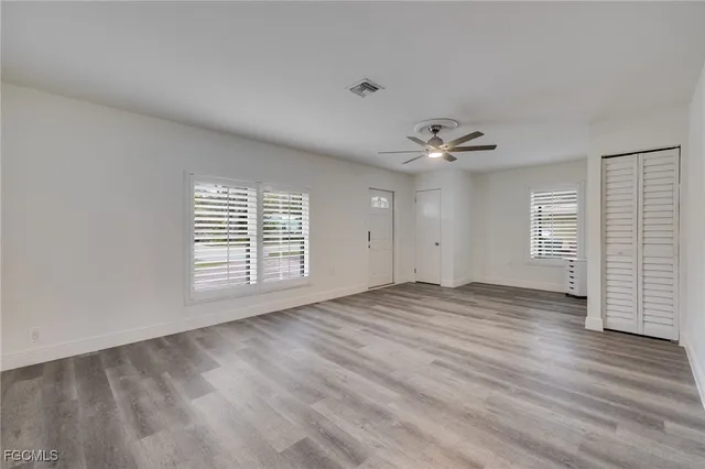 a view of an empty room with a window