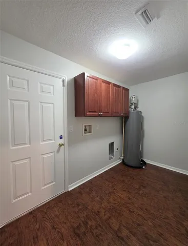 a view of cabinets and wooden floor