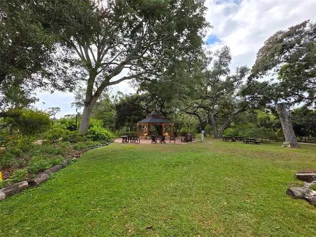a view of statue in a garden