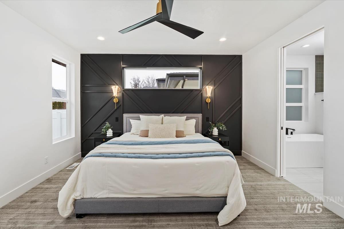 6248 West Elmer Street Boise, ID 83703 - Photo 15 of 40 Bedroom featuring ceiling fan, recessed lighting, light colored carpet, connected bathroom, and an accent wall
